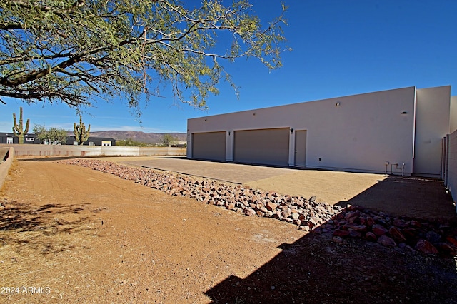 rear view of house with a mountain view