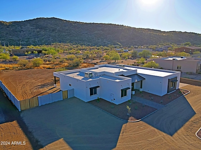 birds eye view of property featuring a mountain view