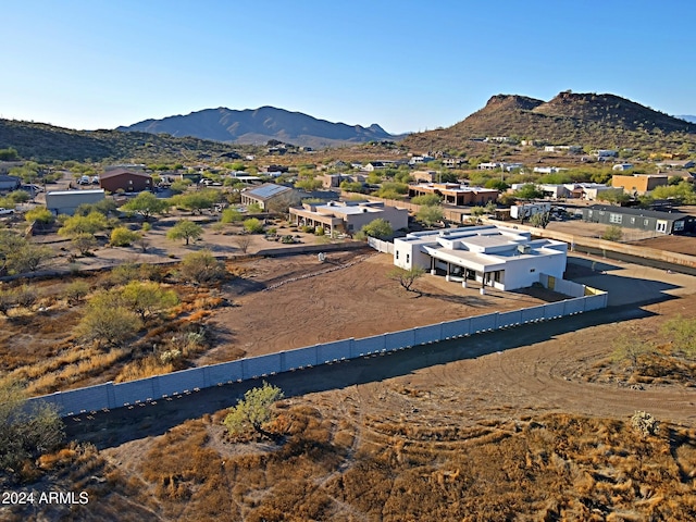 birds eye view of property with a mountain view