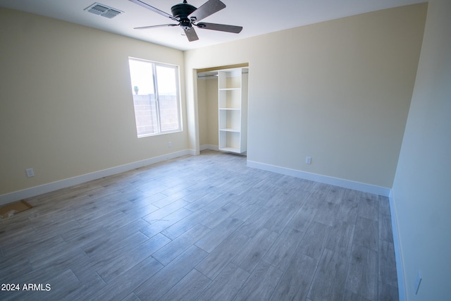 spare room featuring hardwood / wood-style floors and ceiling fan