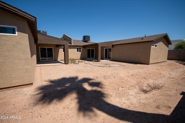 back of property featuring central AC unit and a patio area