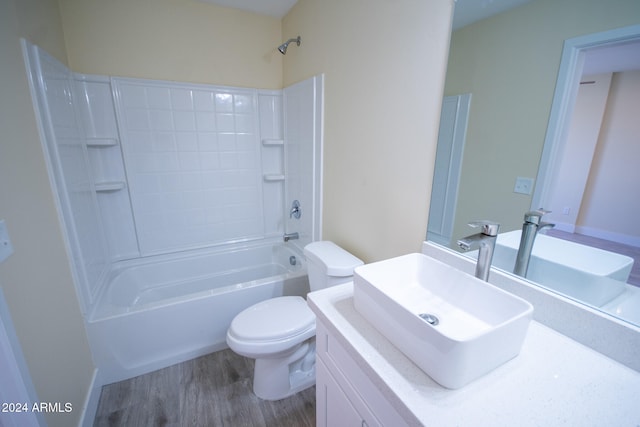 full bathroom featuring shower / bath combination, toilet, vanity, and wood-type flooring