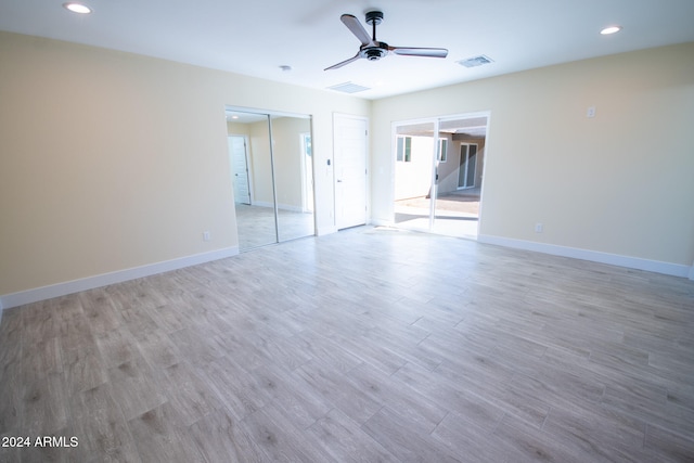 spare room featuring light wood-type flooring and ceiling fan