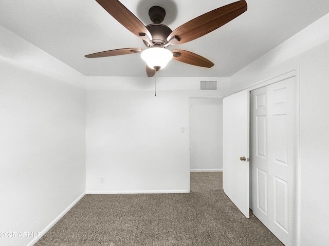 unfurnished bedroom with baseboards, visible vents, and carpet floors