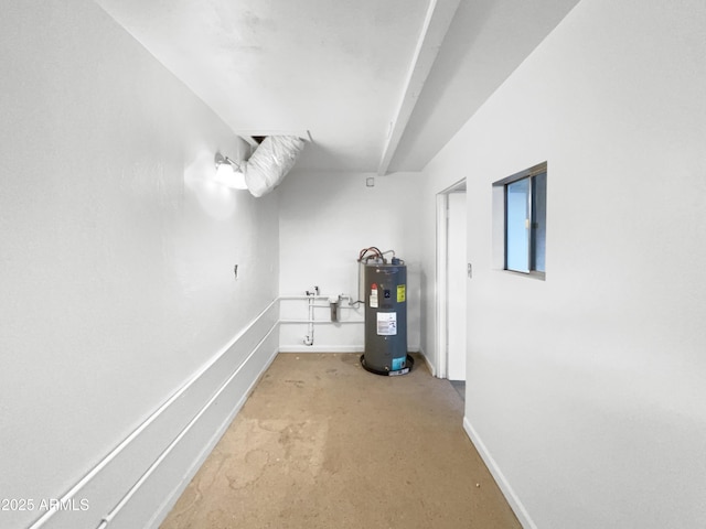 interior space featuring baseboards and electric water heater