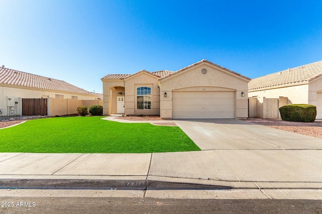 mediterranean / spanish-style home with a tile roof, fence, driveway, stucco siding, and a front lawn