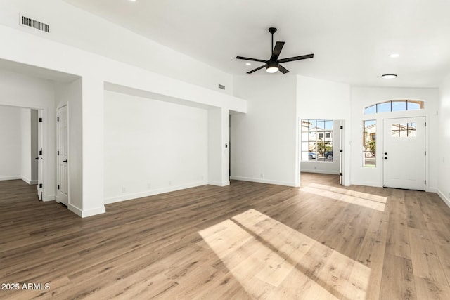 unfurnished living room with recessed lighting, visible vents, ceiling fan, wood finished floors, and baseboards