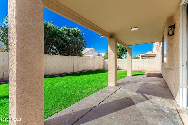 view of yard featuring a patio area and a fenced backyard