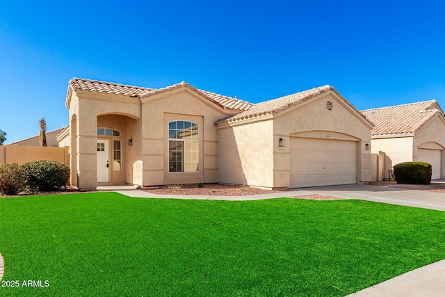 mediterranean / spanish home featuring a tiled roof, a front lawn, and stucco siding