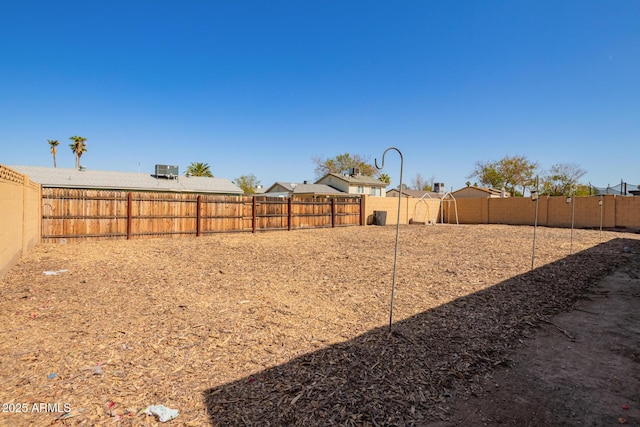 view of yard with a fenced backyard