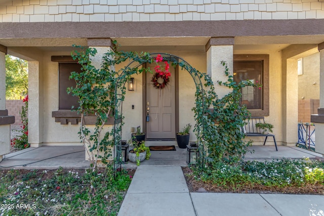 doorway to property featuring a porch