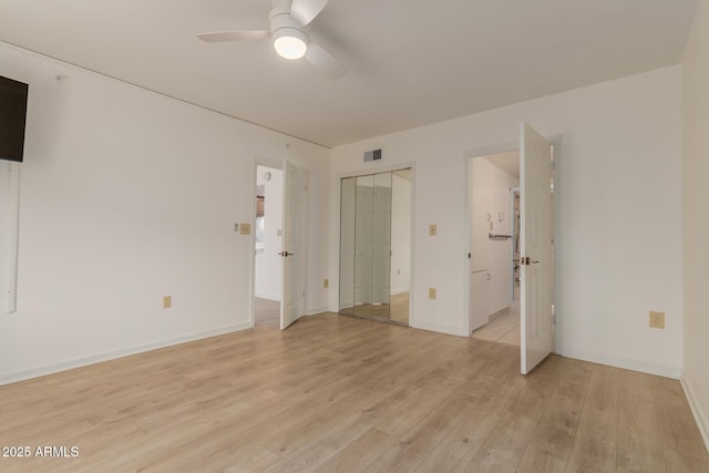 10330 W Thunderbird Blvd Unit C109, Sun City, AZ 85351 - unfurnished bedroom with light wood-style floors, ensuite bathroom, and ceiling fan