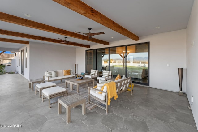 view of patio with an outdoor hangout area and a ceiling fan