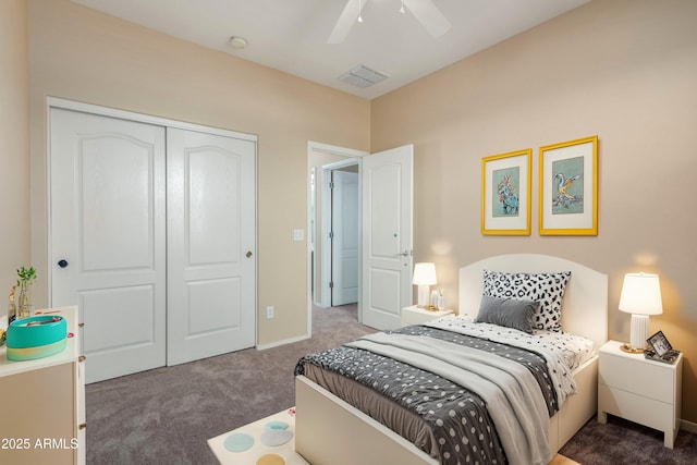 carpeted bedroom with ceiling fan and a closet