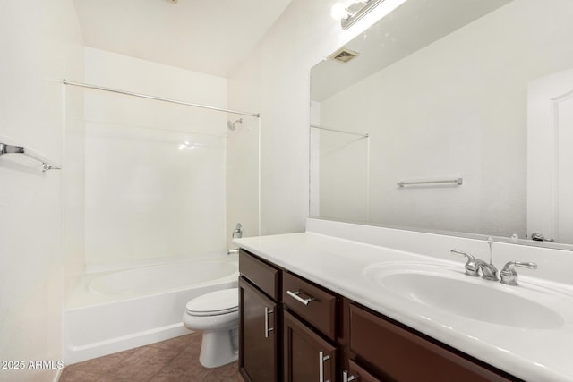 full bathroom featuring vanity, bathtub / shower combination, tile patterned floors, and toilet