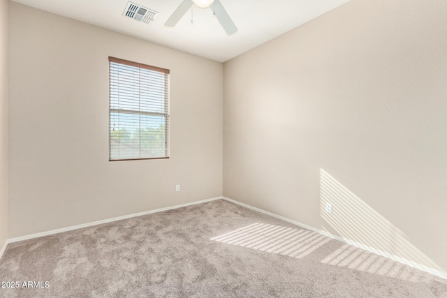 carpeted empty room featuring ceiling fan