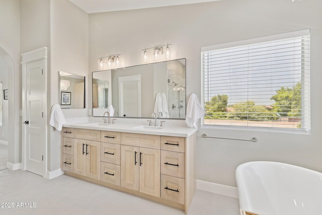 2258 N Gentry, Mesa, AZ 85213 - bathroom with a soaking tub, double vanity, a shower stall, and tile patterned flooring