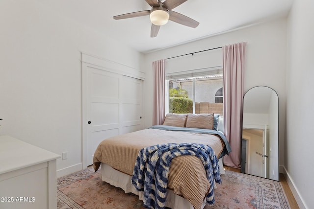2258 N Gentry, Mesa, AZ 85213 - bedroom with ceiling fan, a closet, and light wood-style floors