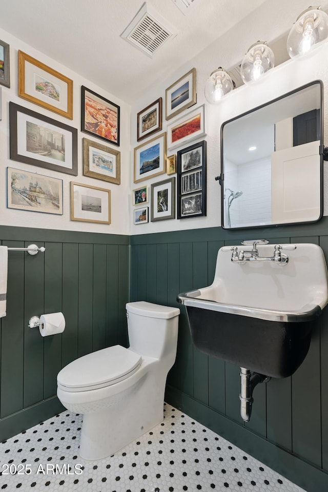 2258 N Gentry, Mesa, AZ 85213 - bathroom with toilet and wainscoting