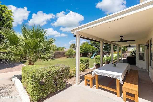 2258 N Gentry, Mesa, AZ 85213 - fenced backyard with a patio area, outdoor dining area, ceiling fan, and a playground