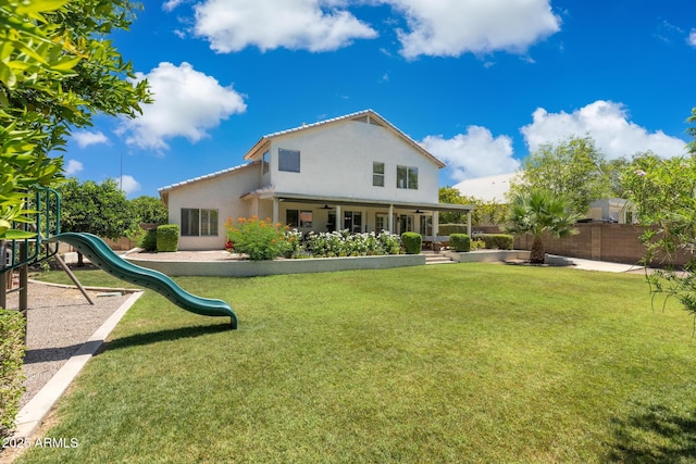 2258 N Gentry, Mesa, AZ 85213 - rear view of property featuring ceiling fan, stucco siding, and a playground