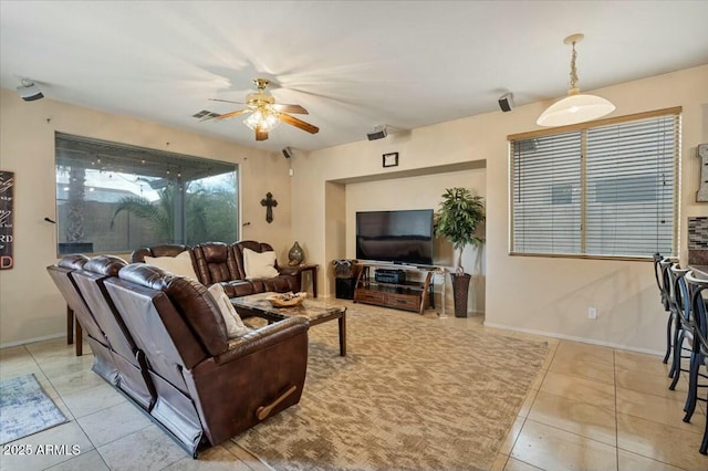 living room with ceiling fan and light tile patterned floors