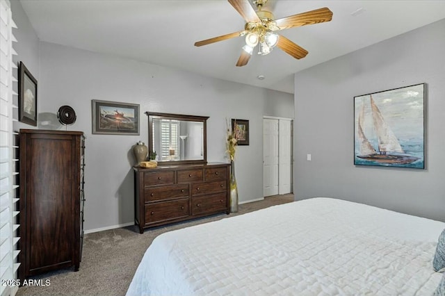 bedroom featuring ceiling fan, a closet, and dark carpet