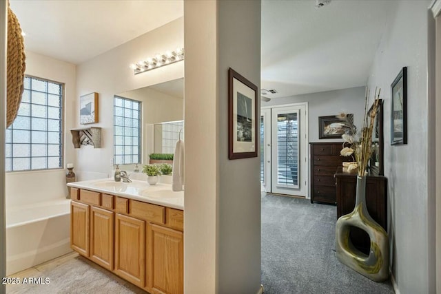 bathroom featuring vanity and a bathtub