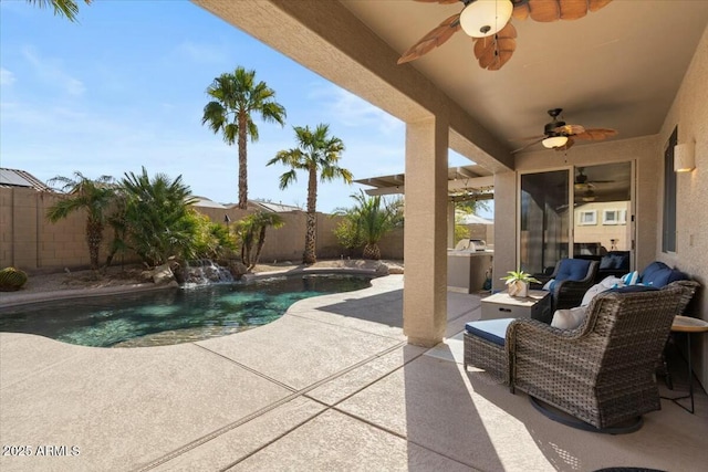 view of patio / terrace featuring ceiling fan, pool water feature, area for grilling, and a fenced in pool