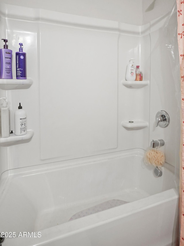 bathroom featuring shower / tub combo with curtain