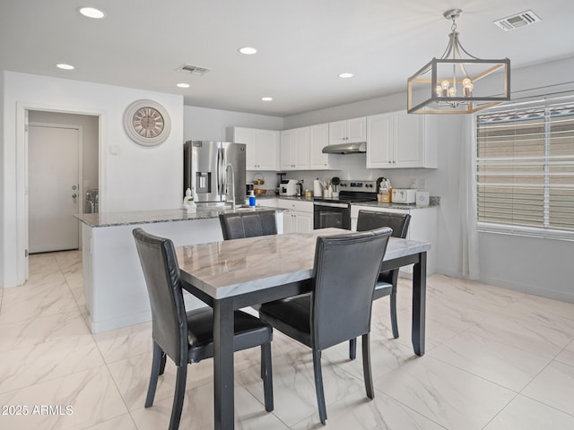 dining area featuring a chandelier, visible vents, marble finish floor, and recessed lighting