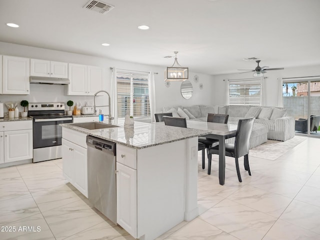 kitchen with visible vents, a sink, stainless steel appliances, under cabinet range hood, and open floor plan