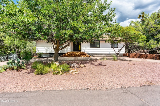 view of property hidden behind natural elements