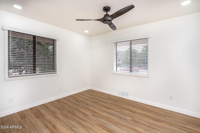 unfurnished room featuring ceiling fan and wood-type flooring