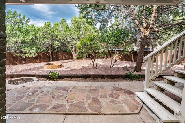 view of patio with an outdoor fire pit