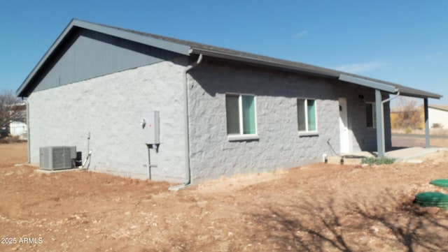 back of property with central air condition unit