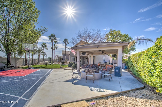 view of patio / terrace featuring a fire pit and ceiling fan