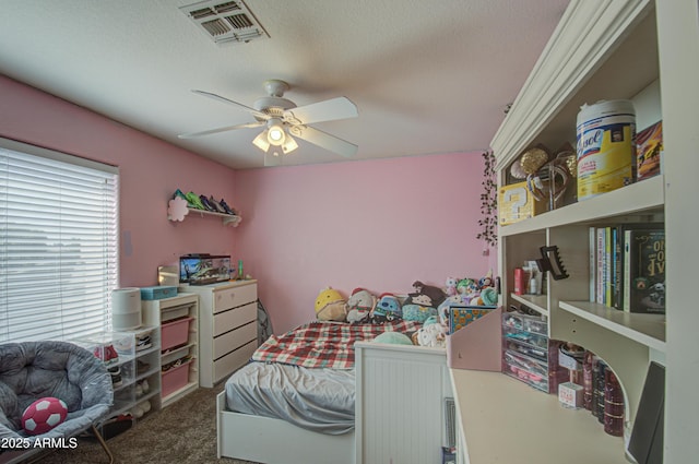 bedroom featuring dark carpet and ceiling fan