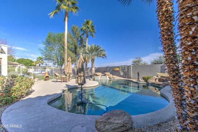 view of swimming pool with a patio area