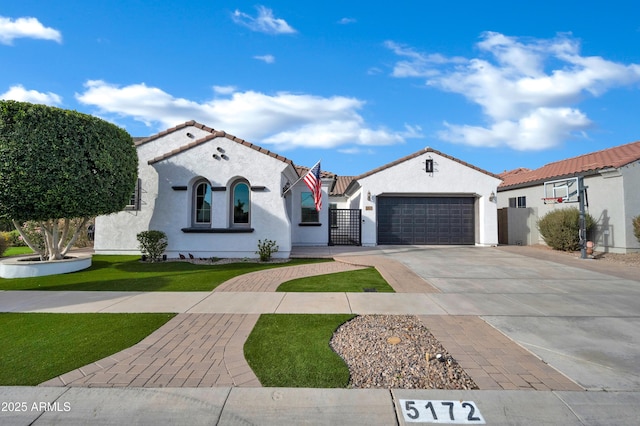 mediterranean / spanish-style house with a garage