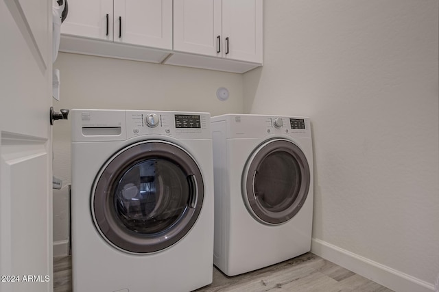 211 S Thunder Mtn, Payson, AZ 85541 - washroom with independent washer and dryer, light wood-style floors, cabinet space, and baseboards