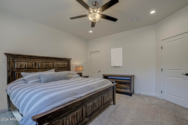 carpeted bedroom featuring ceiling fan