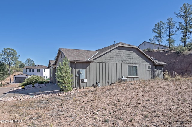 211 S Thunder Mtn, Payson, AZ 85541 - view of side of property with board and batten siding and a garage
