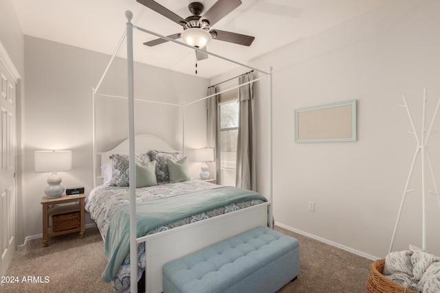 carpeted bedroom featuring a ceiling fan and baseboards