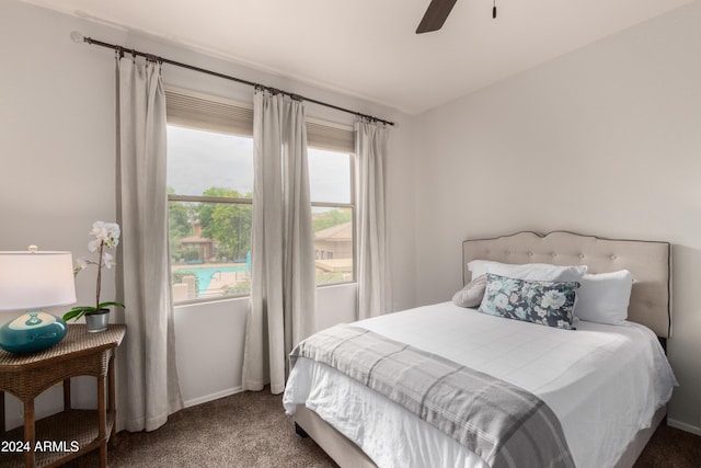 bedroom with carpet floors, a ceiling fan, and baseboards