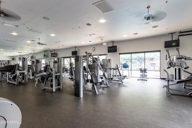 workout area featuring a ceiling fan and visible vents