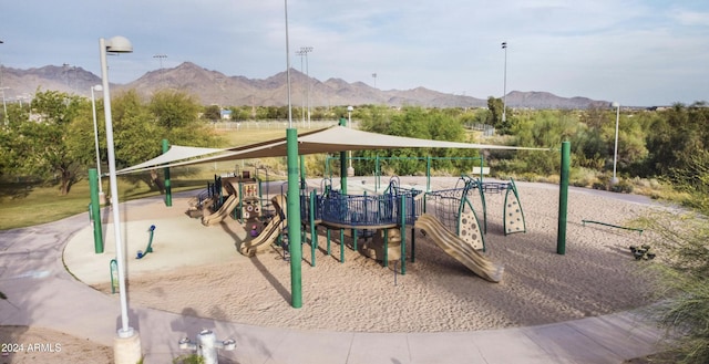 communal playground featuring a mountain view