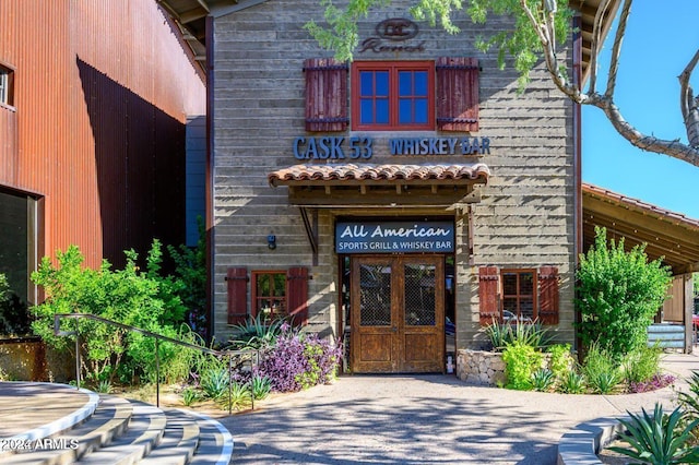 view of exterior entry featuring french doors