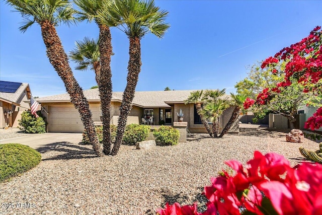 view of front of home featuring a garage, stucco siding, and driveway