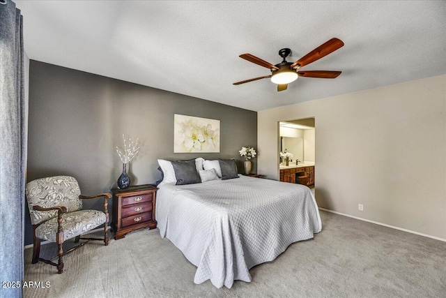 bedroom featuring carpet flooring, a ceiling fan, baseboards, and connected bathroom